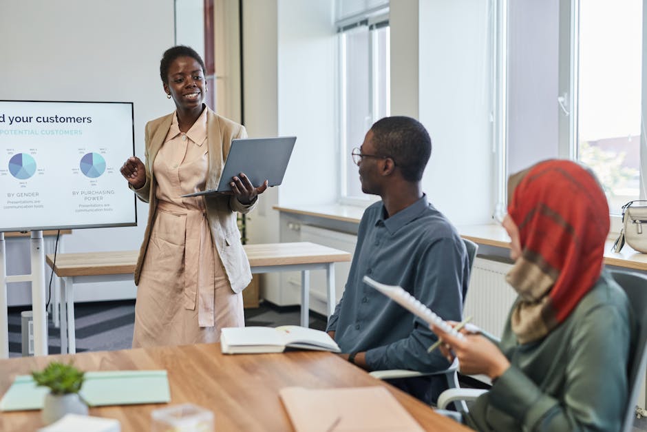 Business professionals in a meeting room focusing on a presentation with charts and data.
